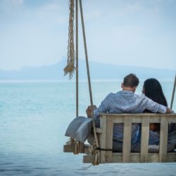 Couple-on-Wooden-Swing-by-the-beach-Treehouse-Villas-Koh-Yao-near-Phuket
