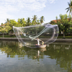 Fisherman Casting Fishing Net At The Resort Riverfront - Anantara Hoi An Resort